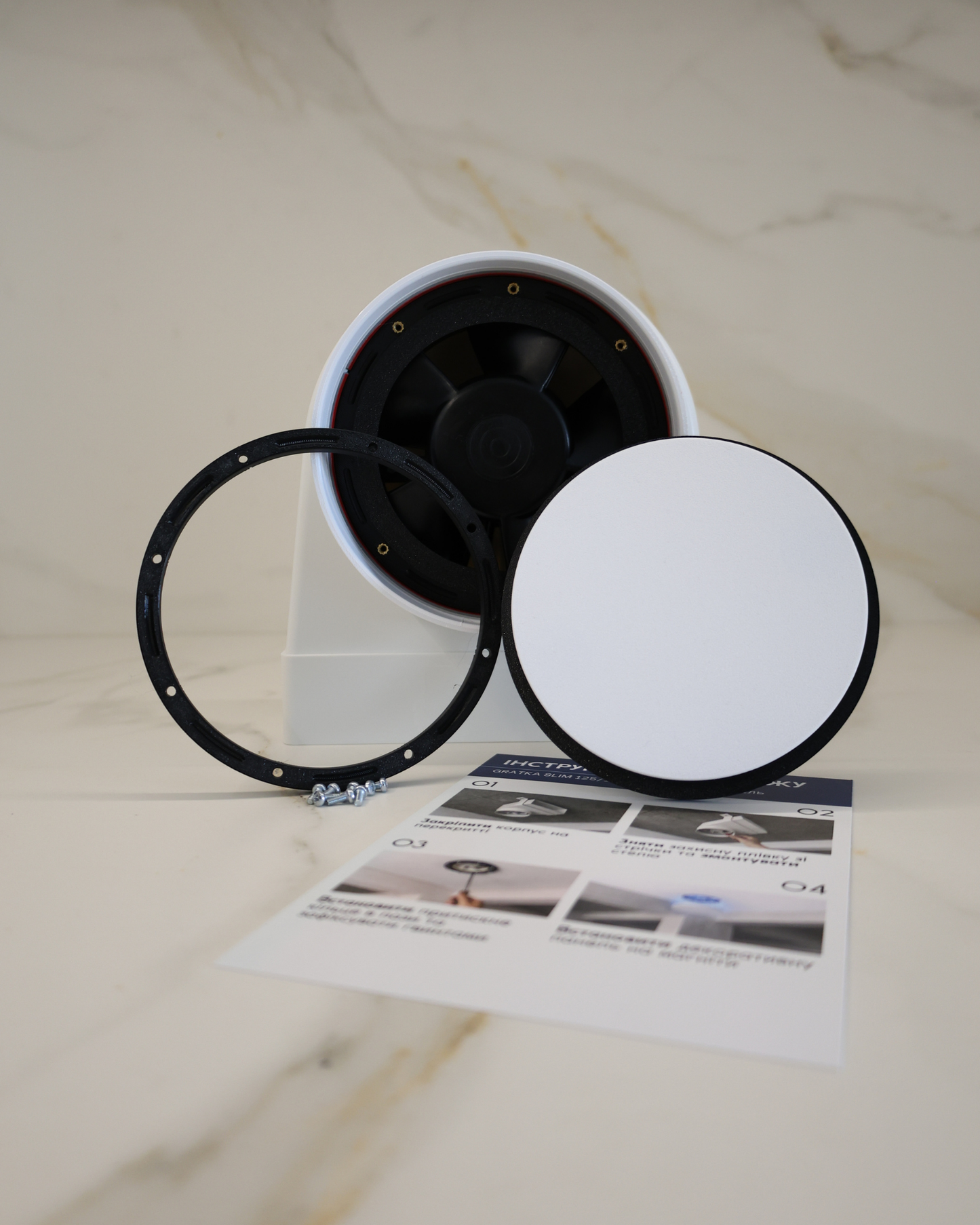 GRATKA SLIM 150 flush mount exhaust fan with all components: housing, pressure ring, magnetic decorative panel and mounting hardware