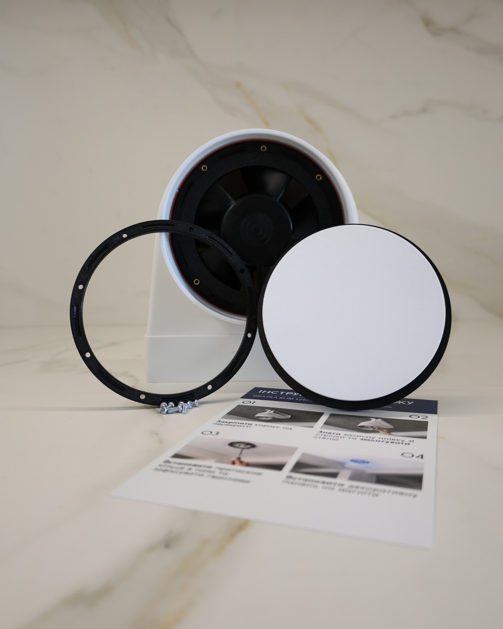 GRATKA SLIM 150 flush mount exhaust fan with all components: housing, pressure ring, magnetic decorative panel and mounting hardware