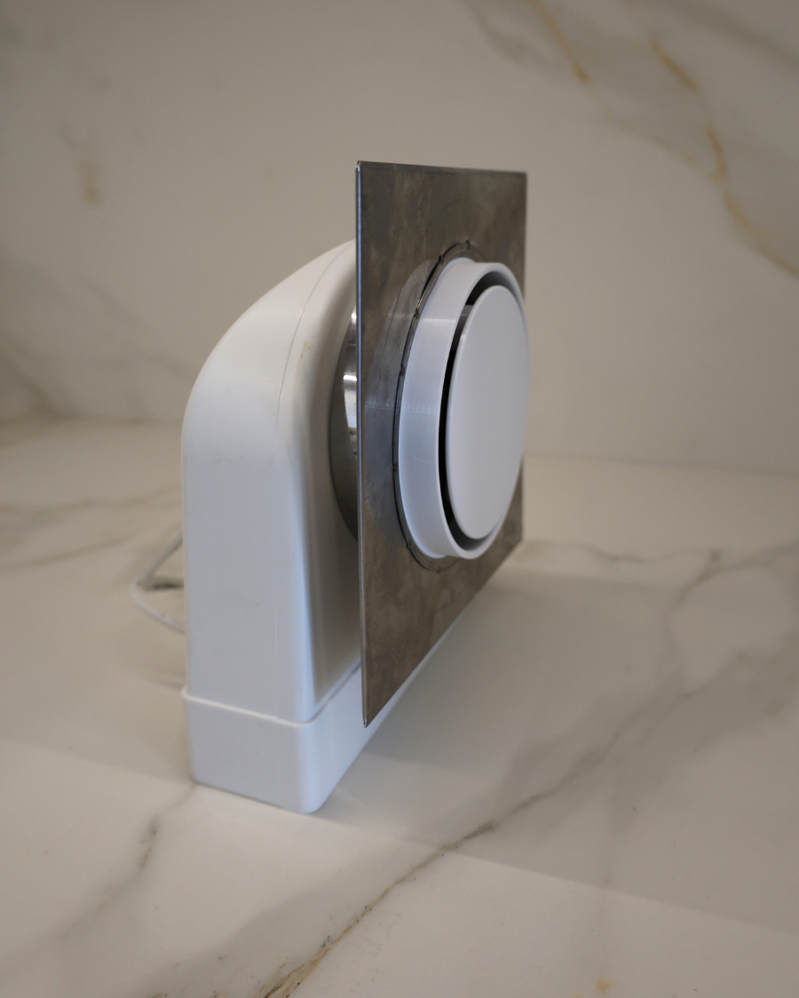 Side view of fully assembled GRATKA SLIM 125 drywall fan with mounting plate and round designer cover
