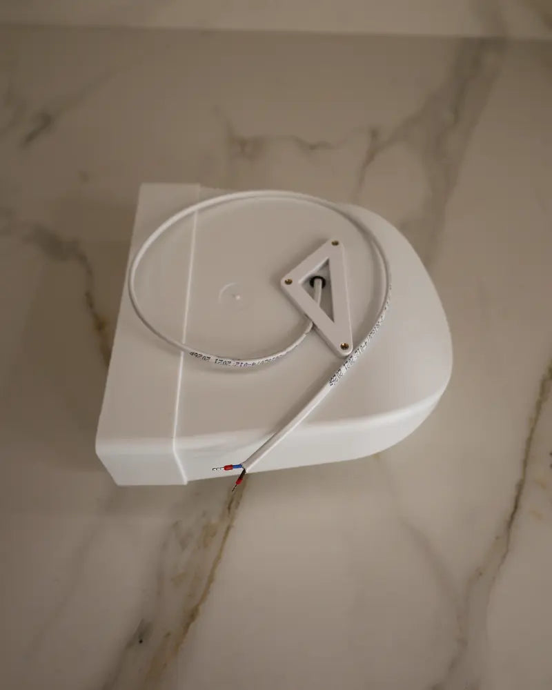 Top view of GRATKA SLIM 125 exhaust fan showing electrical wiring connection