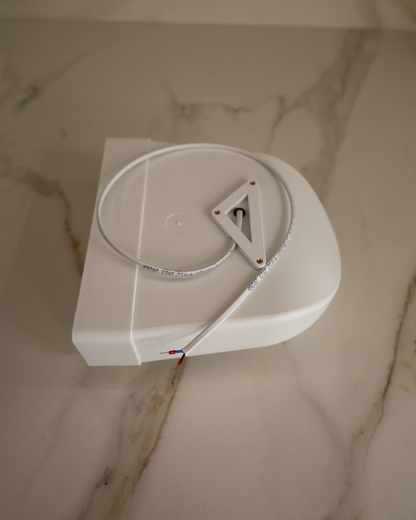Top view of GRATKA SLIM 150 housing with power cable and flat 60x204 mm duct outlet for stretch ceiling installation