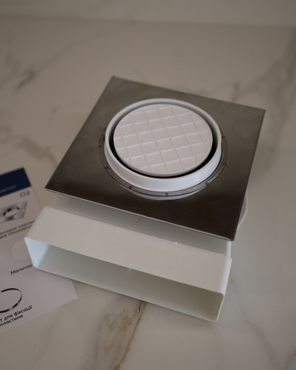 Top view of GRATKA SLIM 125 drywall fan showing metal flange and 60x204 mm flat duct connection